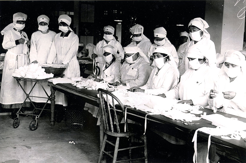 Boston Red Cross volunteers assemble gauze influenza masks for use at hard-hit Camp Devens, Massachusetts.
