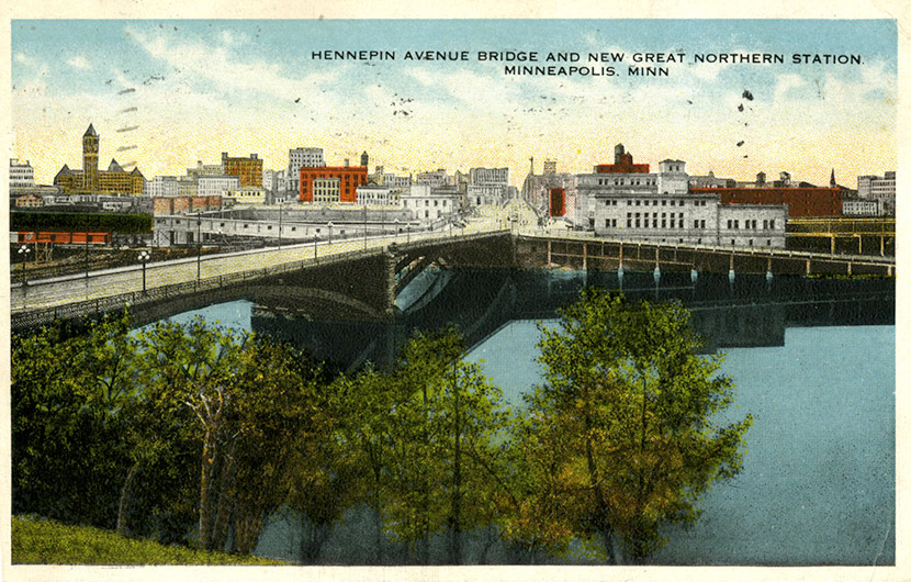 The Hennepin Ave. Bridge, as seen from Nicollet Island. The Great Northern Station, built in 1913, is in the background, across the street from the post office. The station was razed in 1978.