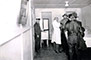 A group of Seattle men line up to receive their influenza vaccines, ca. November 1918. Seattle, like several other cities, placed great emphasis on a public vaccination campaign as a way of halting the spread of the disease. Unfortunately, vaccines at the time were useless.