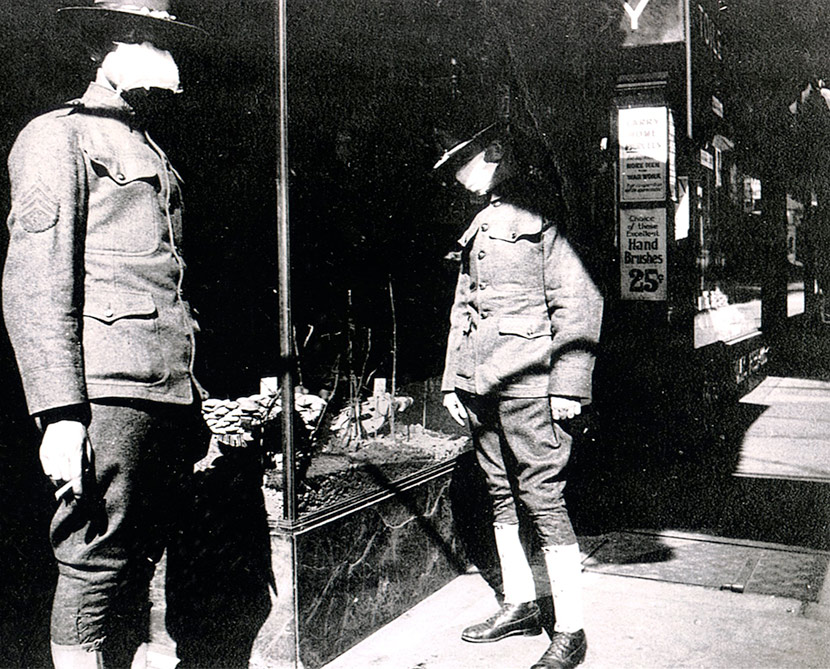 Soldiers from Camp Gordon, Georgia, passing through Cincinnati wearing flu masks. From the National Archives and Records Administration.