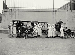 Motor Corps and Canteen volunteers from the Detroit chapter of the American Red Cross, taking a break from delivering supplies to influenza victims.