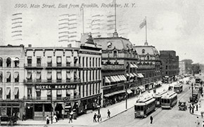 Main Street looking East from Franklin ca. 1912. The next year, the Hotel Rexford (8 Franklin Street) became the Hotel Berkeley. Otherwise, the block would have looked much the same in 1918. In 1955, the Monroe County Savings Bank was built on the site. Today, the Salvation Army is located in the building.