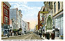 East 7th Street, looking east from Wabasha Street North. The Alhambra Theatre, located at 14 East 7 Street, can be seen on the right. The theater, which entertained up to 425 patrons per show, operated from 1911 to 1930. During the epidemic, public health officials closed the Alhambra and all other theaters and public entertainment venues in the city.