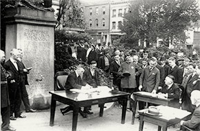 Open-air police court being held in Portsmouth Square, San Francisco. To prevent crowding indoors, judges held outdoor court sessions.