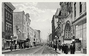 East 7th Street, looking east from Wabasha Street North. The Alhambra Theatre, located at 14 East 7 Street, can be seen on the right. The theater, which entertained up to 425 patrons per show, operated from 1911 to 1930. During the epidemic, public health officials closed the Alhambra and all other theaters and public entertainment venues in the city.